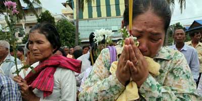 Relatives of Khmer Rouge victims take part in an emotional prayer ceremony in Phnom Penh, Cambodia. Photo: Paula Bronstein/Getty Images