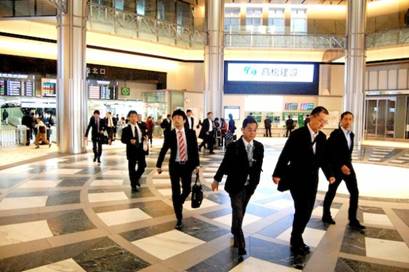 Japanese men heading to work - they continue to dominate work space, Credit: Daan Bauwens/IPS.