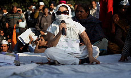 An acid attack victim tells her story at a protest against rape in New Delhi 