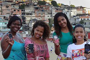 Nubia Felix (right) is one of the projects community trainers in the favela of Complexo do Alemo.