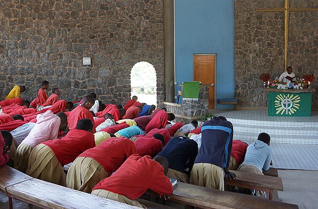 Girls praying during chapel at the MaaSAE Girls Lutheran Secondary School.