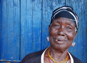 Nziku left her village after she received threatening letters. Her community brought her back and built her a new house.