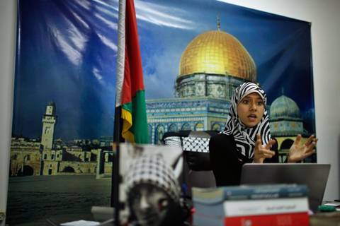 Isra Al-Modallal, a spokeswoman of the Hamas government in Gaza, talks to the foreign media at her office in Gaza City