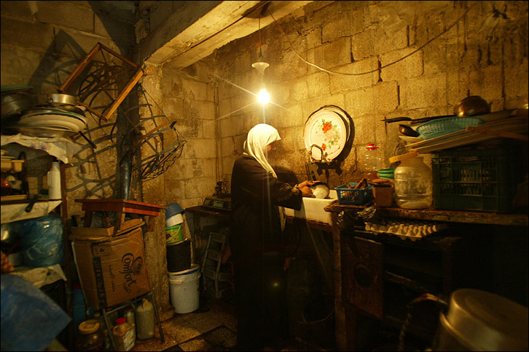 A Gazan woman cooking in her kitchen