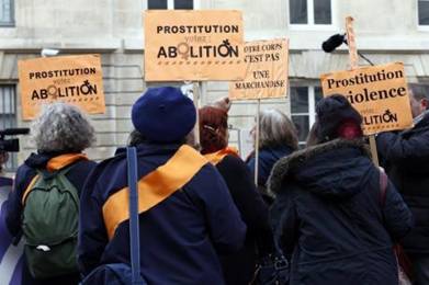 People attend a demonstration to abolish prostitution in France in front the National Assembly in Paris November 29, 2013. REUTERS/Charles Platiau