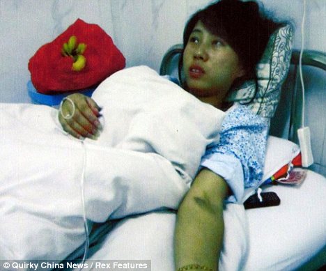 Horrific: Feng Jianmei said she was forceably injected with a chemical to induce an abortion and her child was stillborn 36 hours later