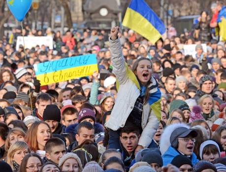 Students hold placards and flags as thousands of pro-European supporters rally in the western Ukrainian city of Lviv on Nov. 27, the fourth day of massive demonstrations.