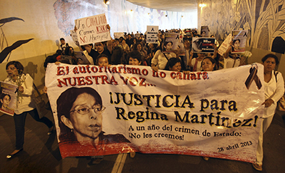 Journalists protest the one-year anniversary of the murder of journalist Regina Martnez Prez. Anti-press attacks are so common that Mexican authorities passed a bill authorizing federal authorities to prosecute crimes against journalists. (AP/Felix Marquez)
