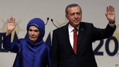 Turkey's PM Recep Tayyip Erdogan and his wife Emine Erdogan salute his ruling party members in Ankara, Turkey, 1 July 2014. 