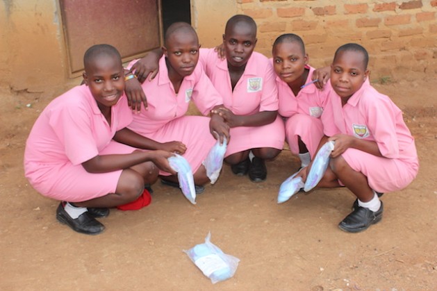 Students from Great Horizon Secondary School in Uganda's rural Kyakayege village pose proudly with their re-usable menstrual pads after a reproductive health presentation at their school. Credit: Amy Fallon/IPS