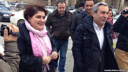 Azerbaijani investigative journalist Khadija Ismayilova (left) outside the Prosecutor General's Office in Baku in February with her lawyer Elton Guliyev. Ismayilova fears she will soon be detained as part of a crackdown on civil society in Azerbaijan. 