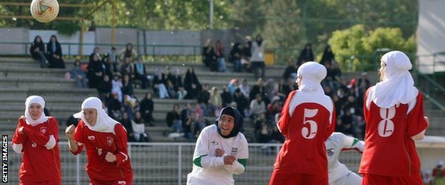 Women footballers wearing hijabs