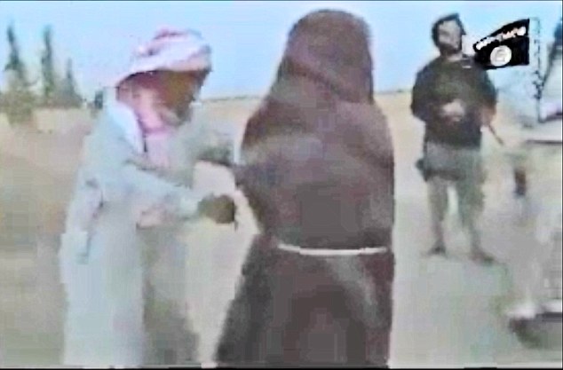 Shocking: As the militants rain down rocks on the defenseless woman, her father (left) steps forward and picks up the largest rock before using it to strike and kill his daughter