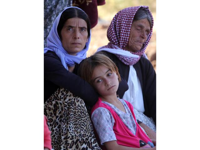 These Iraqi Yazidis women and children, are among the thousands who fled their homes in Sinjar when Islamic State militants attacked during the summer, finding refuge in the Kurdish city of Dohuk in Iraq's autonomous Kurdistan region. The Independent Human Rights Commission in Iraq has reported women and girls who are not able to escape from the advancing militants, are subjected to repeated rape, forced conversion to Islam and being sold from one group to another.
