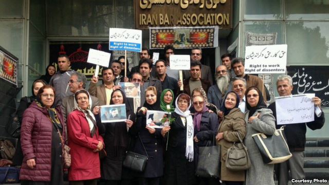 Nasrin Sotoudeh (center, holding flower) demonstrates in front of Iran's Bar Association last month along with a number of supporters.