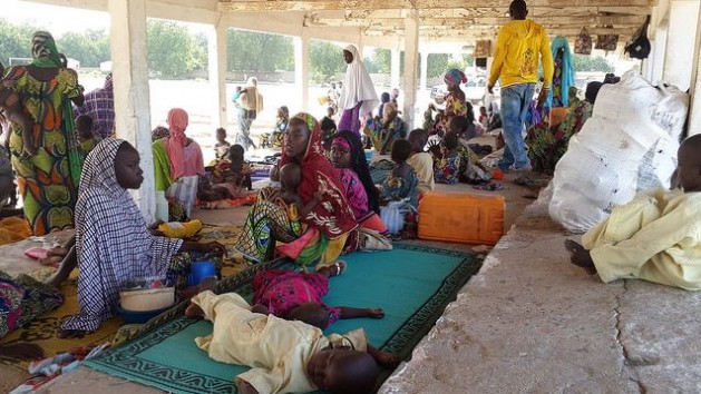 A group of Nigerian refugees rests in the Cameroon town of Mora, in the Far North Region, after fleeing armed attacks by Boko Haram insurgents on Sep. 13, 2014. Credit: UNHCR / D. Mbaoirem