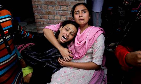 Girls mourn over a family member who was killed by a suicide bombing attack near two churches in Lahore, Pakistan, Sunday, March 15, 2015. &mdash; AP
