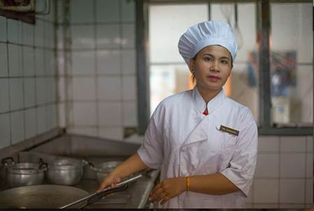tktkt. A cook in a hotel restaurant in Luang Prabang, Laos. ADRI BERGES/ILO
