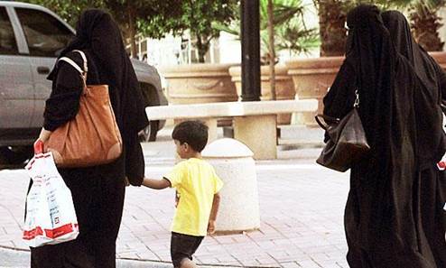 In this file photo, Saudi women and a child walk along a street in Riyadh. (AFP)