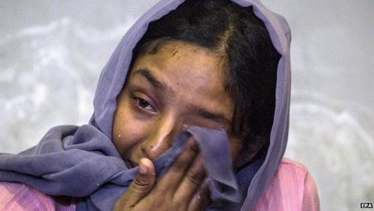 Humahai, a Rohingya migrant from Myanmar crying in Lhok Sukon Sport Stadium, North Aceh, Sumatra, Indonesia, 11 May 2015. I