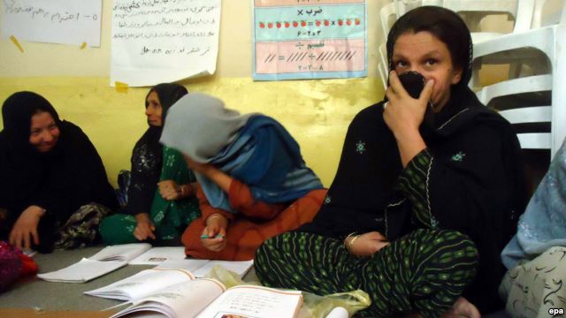 Women learn to read and write at at a vocational training institute run by the Afghan Women's Affairs Department in Kunduz.