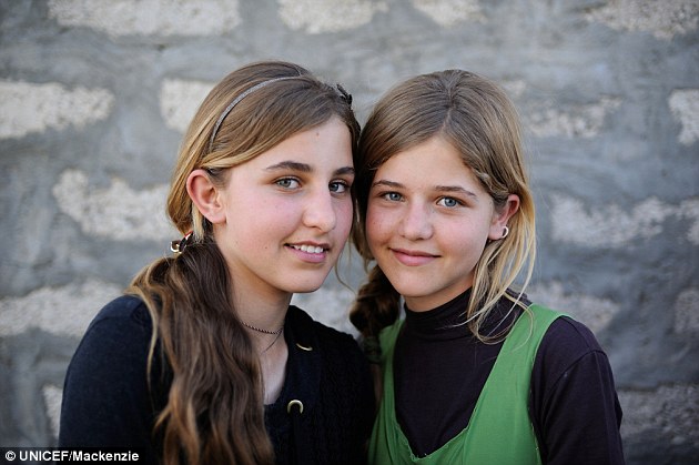 Ambitions: Bushra, pictured here with her sister, has been inspired by the workshop and now wants to be a photojournalist